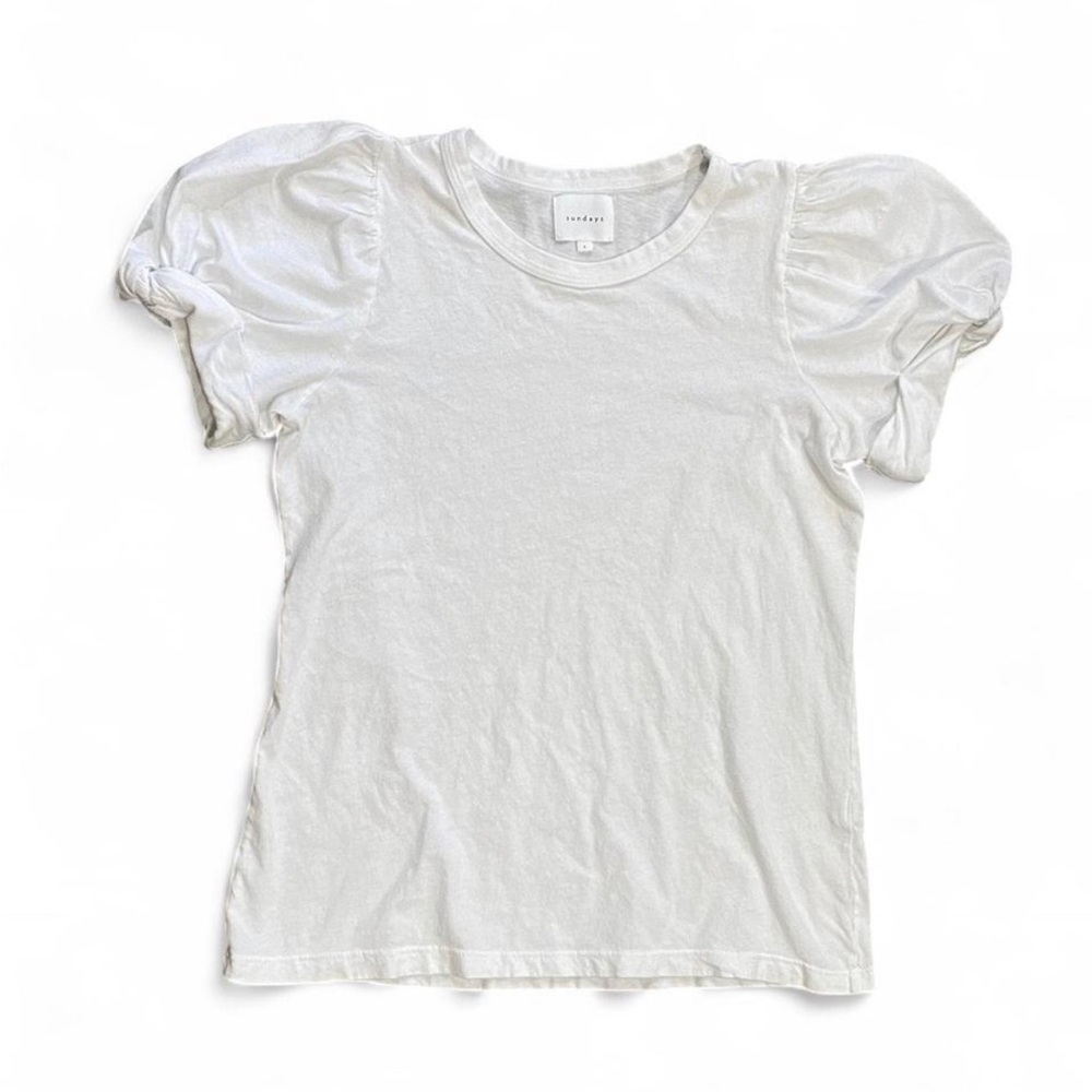 We are Sundays white puff short sleeve blouse. Size 0.